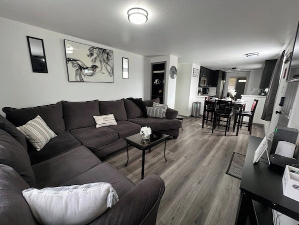Spend an enjoyable evening on this spacious sectional with a 65-inch TV for enjoy a football game or family movie night.