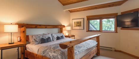 Main Bedroom - Spacious and open to downstairs main bedroom with King bed, TV, walk in closet and ensuite bath.