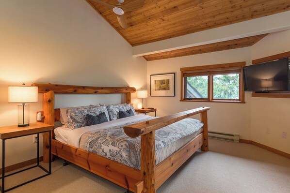 Main Bedroom - Spacious and open to downstairs main bedroom with King bed, TV, walk in closet and ensuite bath.