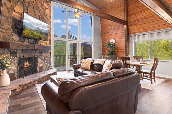 Bright open living space with leather seating and Smart TV