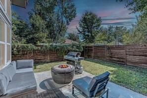 Warm up by the firepit in the backyard