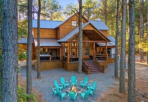 This fire pit area invites you to gather around for s’mores, stories, and stargazing under the tall trees.