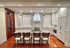 kitchen with large island and bar seeting for four 