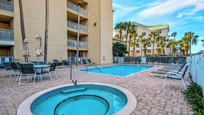 Emerald Dunes has a large pool (heated seasonally) and hot tub with plenty of lounge seating! 