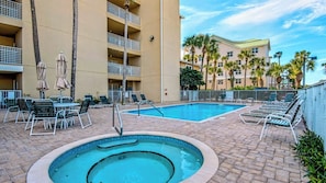 Emerald Dunes has a large pool (heated seasonally) and hot tub with plenty of lounge seating!