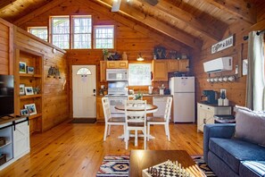 [Dining Area] Whether it’s coffee for two or a homemade dinner, the rustic table is the heart of the cabin.