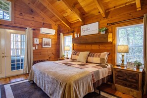 [Bedroom] Our king-size memory foam mattress delivers a dreamy night’s sleep beneath the warm glow of wood.