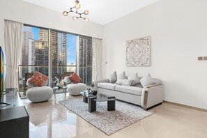 Living Room: Stylish space with city views, plush seating, and chic decor for relaxation!