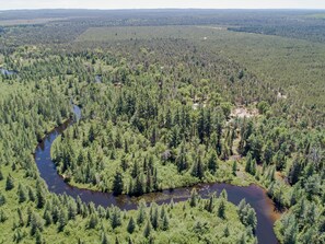 OVERALL:  Goose Creek near the lodge.  (The lodge is mostly hidden by the trees.)
