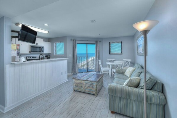 Relax in the comfort of a well-appointed living room with an ocean view.