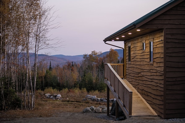 Exterior side of house with ramp onto back porch