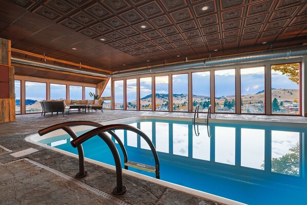 Enjoy a swim in the enormous indoor pool overlooking stunning mountain views