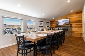 Dedicated dining room seats twelve, with additional seating at the nearby coffee bar and island