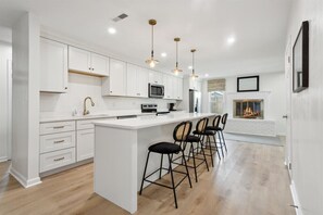 The kitchen can comfortably seat everyone in the home with casual dining.