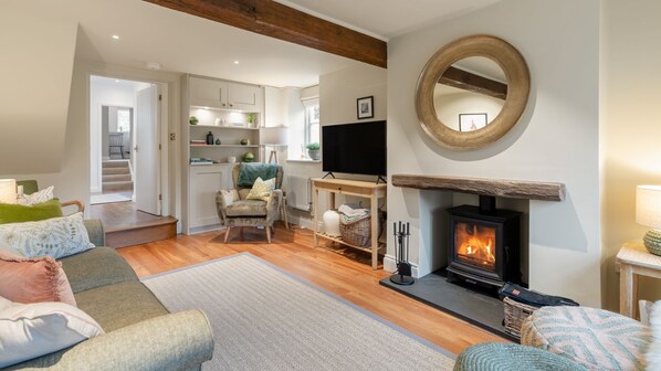 Relax fireside with a glass of wine and your favourite film