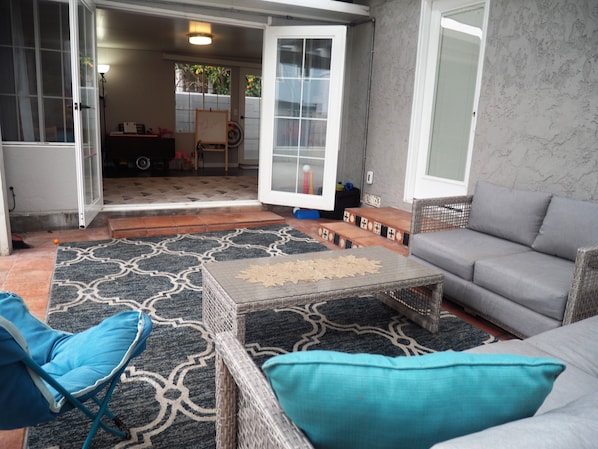 Back outdoor patio off kids play room.