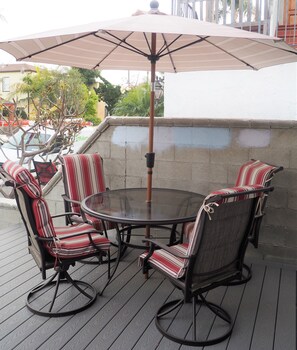 Front patio for coffee or watching a sunset. Just feet to the beach!