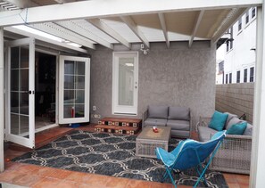 French doors and bedroom door open to back patio