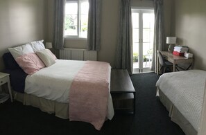 Master bedroom opens out onto the deck. (Queen Bed and Single)