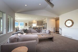 The living room boasts abundant natural light and a welcoming fireplace.