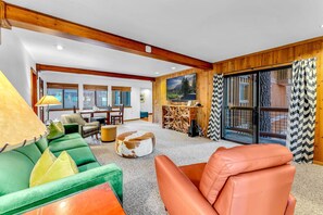 Bonus room: Couch, table w/2 chairs, 65” TV, access to backyard, lower floor
