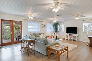 Open concept living area with flat screen TV
