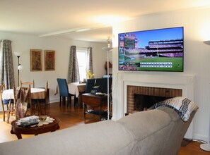65" smart TV with cable service, streaming services. Swivel mount.