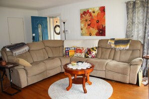 Living and Dining Area - Comfortable seating. End sections recline.