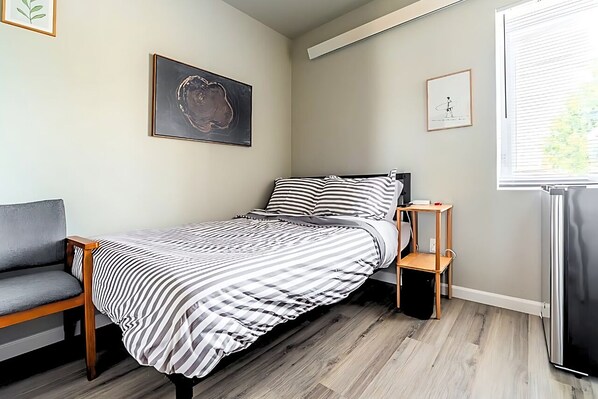 Cozy and calm, this small bedroom is your perfect retreat for rest and focus. 