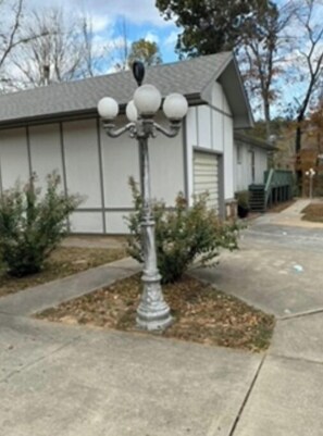 Parking left of yard light.
