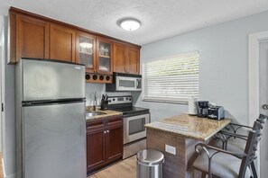 Fully stocked kitchen and dining area
