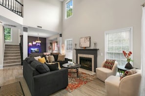 With comfortable seating, warm fireplace, and soaring ceilings.