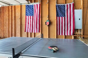 Challenge your friends to a friendly ping pong match in this fun game room!