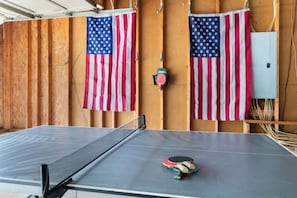Challenge your friends to a friendly ping pong match in this fun game room!
