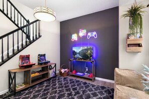 Channel your inner gamer in our retro arcade game room!