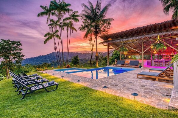 View from the pool area. Situated at an elevation of 1000 feet, CasaLong boasts more than 75 diverse fruit tree varieties and an abundance of tropical flora and fauna for you to enjoy during your stay.
