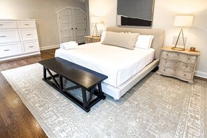 The 3rd floor suite's King bed complements the new en-suite bath and private balcony.