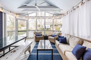 Take the vacation outside to the spacious furnished screened-in patio overlooking the private backyard.
