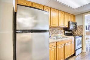 Full Kitchen: Refrigerator, Microwave, Stove/Oven, and Sink.  Whip up a snack or serve a full meal for your family and create amazing beach memories that will last a lifetime.  Sunrise with coffee, and a homecooked breakfast is well worth the stay.