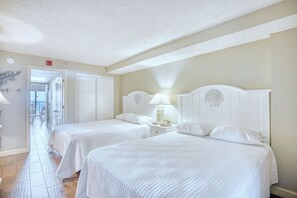 The Main Bedroom with 2 Queen Beds (hotel-styled linens 1,000 count cotton included) and Smart TV is perfect for recovering from a long day of soaking up the Myrtle Beach scene. This beach  oasis is conveniently central to Myrtle Beach amenities.