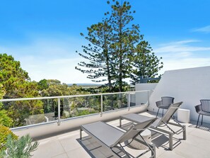 Relaxing sunlounges with a view on the balcony