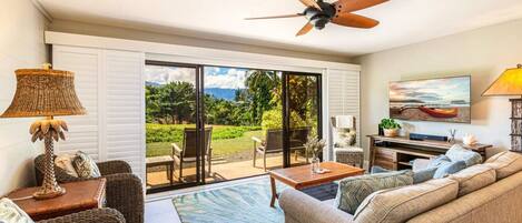 Inside you'll find a comfortable and inviting living space, with updated finishes and plenty of natural light! The couches are comfortable, the TV is plenty big, and the room catches a lovely breeze when the screen doors are open.