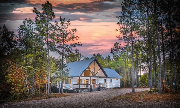 Welcome to your private retreat, where rugged nature meets modern luxury. Nestled among the pines with only a few neighbors nearby, this cabin offers seclusion and upscale comfort—the perfect escape for those seeking style, privacy, and wilderness.