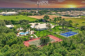 Experience luxury and nature in this exclusive retreat featuring a heated pool.