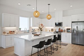 A sleek kitchen with a spacious island