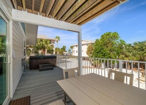porch with outdoor seating, hot tub, and ocean view of Unit B - 2nd level