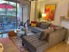 Living room looking onto deck which is next to the main clubhouse pool