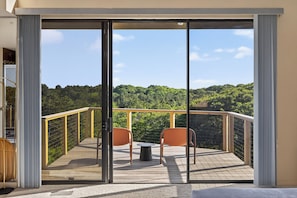 Enjoy a cup of morning coffee on the private master suite balcony.