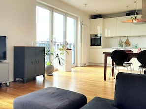 The bright, light-filled living room.