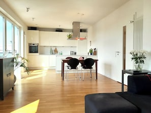 The bright, light-filled living room.